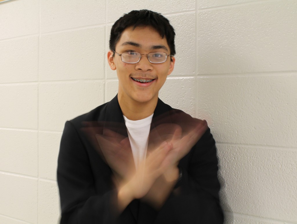 Junior Steven Wang demonstrates his hand clapping skills. 