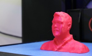 Teacher Bart Taylor's 3-D selfie model rests on the printer platform.