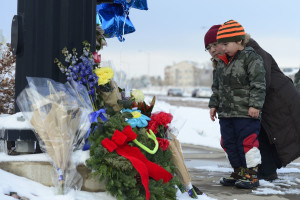 COLORADO SPRINGS, CO - NOVEMBER 29: Nasya Fair looks at the growing memorial for the shooting victims with her son Korbyn, 4, at Fillmore Street and Centennial Boulevard on November 29, 2015 in Colorado Springs, Colorado. The investigation moves into its third day after a gunman attacked a Planned Parenthood, killing three and injuring nine. (Photo by Brent Lewis/The Denver Post via Getty Images)