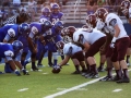 The A&M Consolidated offensive line prepares the ball for the snap.