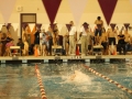Freshman Andrew Zhang prepares to dive in to swim the freestyle leg of the boys' 200 yard medley relay.