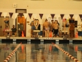 Junior Bridget Griesbach dives in to swim her 200 yard freestyle. She wins her event by over seven seconds.