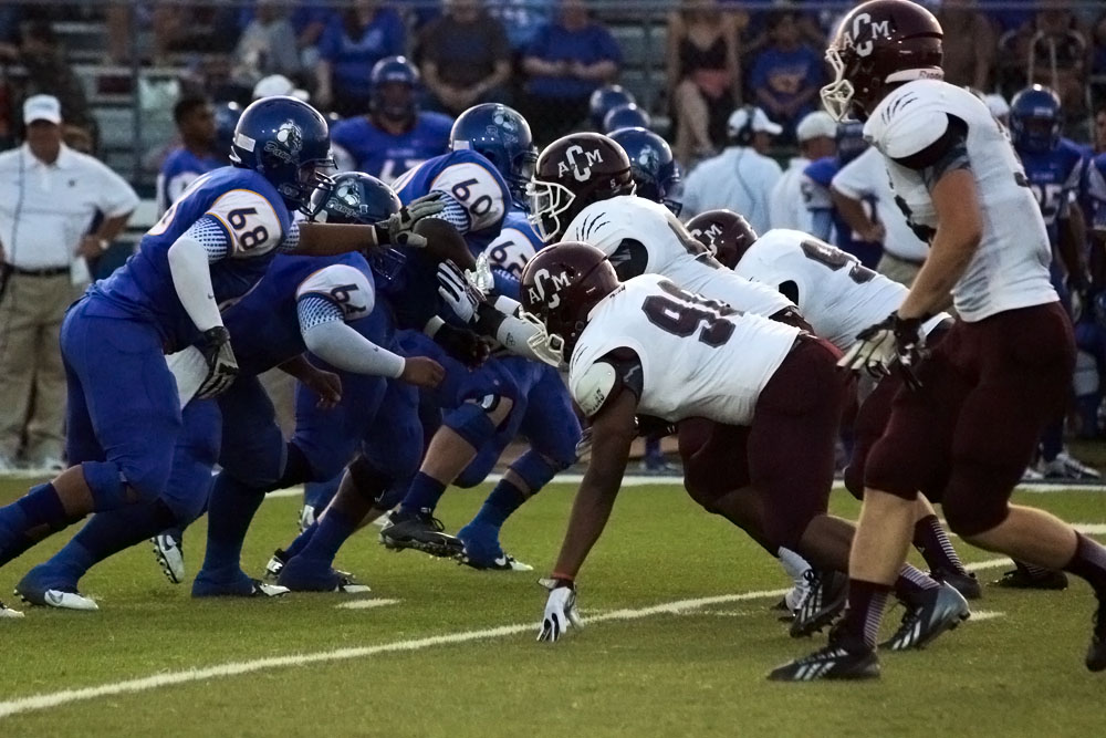The varsity football players of A&M Consolidated High School line up to face Copperas Cove for the first game of the season on Aug. 30, 2013.